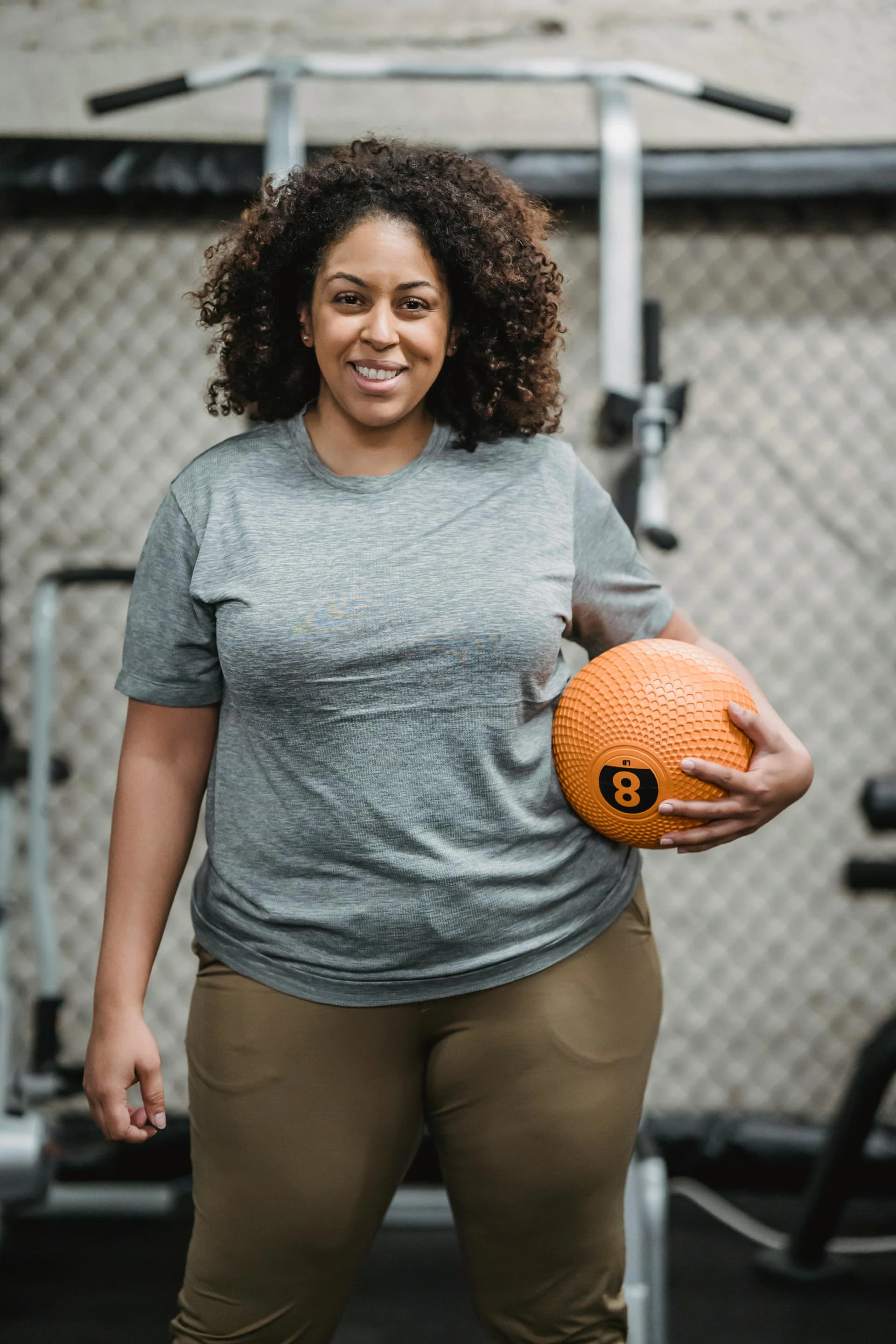 Woman with tablet in gym